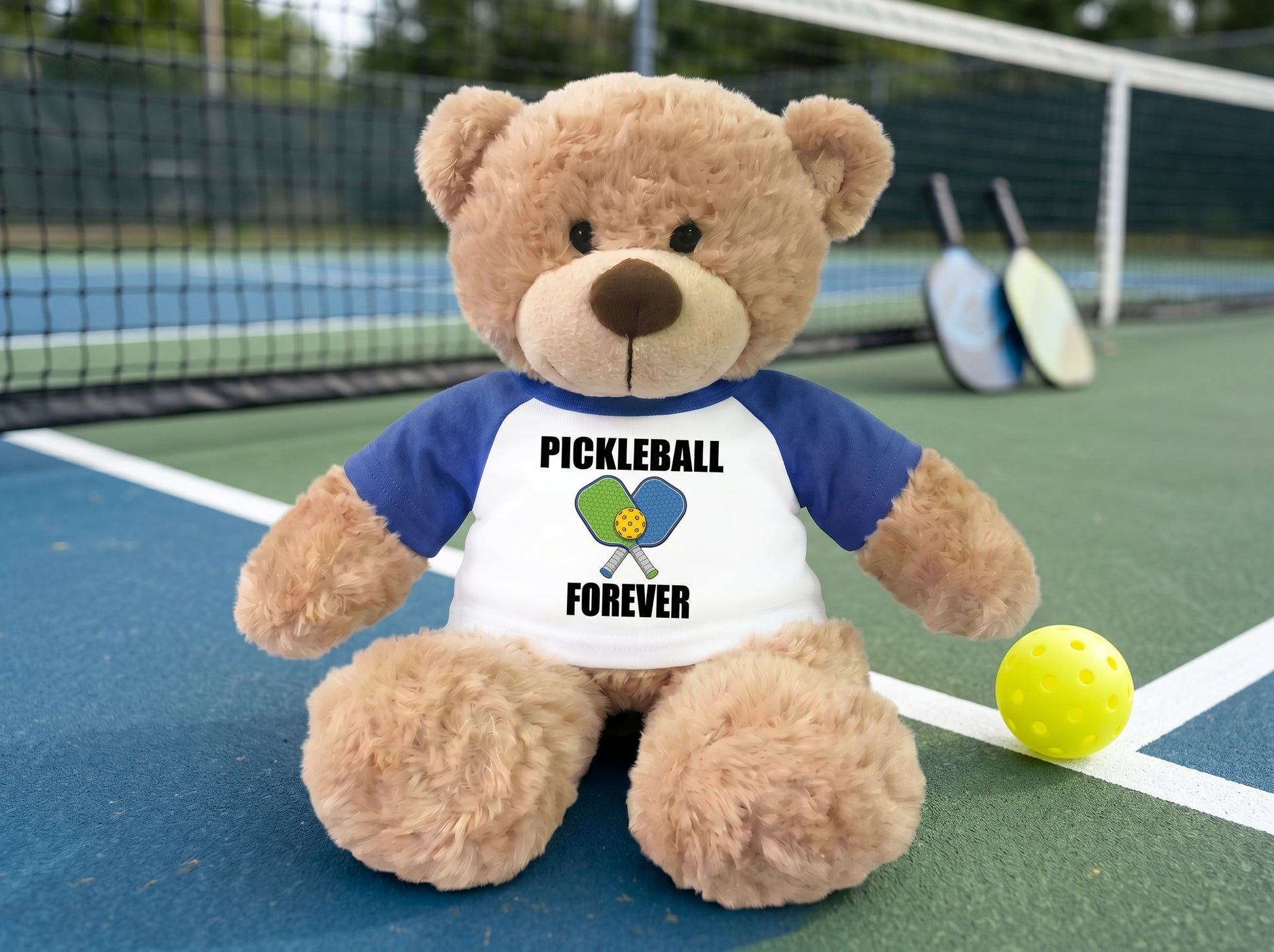 Personalized Pickleball Teddy Bear - 13" Bonny Bear, Paddle Design - royal blue sleeved shirt, pictured on pickleball court